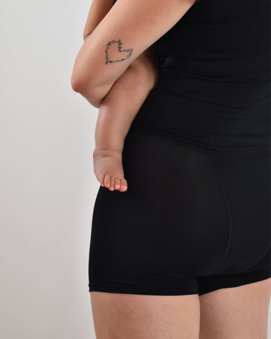 The Shortie in black, worn on model